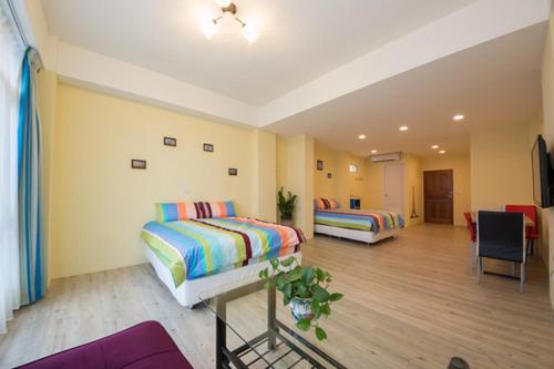 Postel nebo postele na pokoji v ubytování Aqua Night Market Homestay