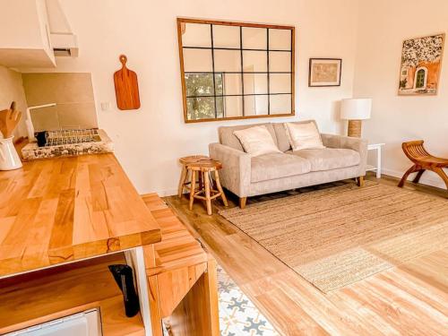 a living room with a couch and a table at Lisbon Countryside - Serenity Near the City in Calhandriz