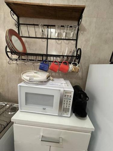Una cocina o zona de cocina en Ap Aconchegante Catanduva II