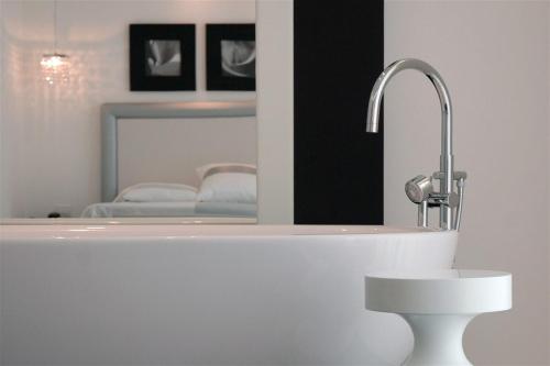 a bathroom with a sink and a mirror at Hotel Royal Paestum in Paestum