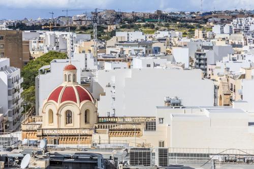a view of a city with a red dome at Dolce Pieta' Penthouse in Pieta