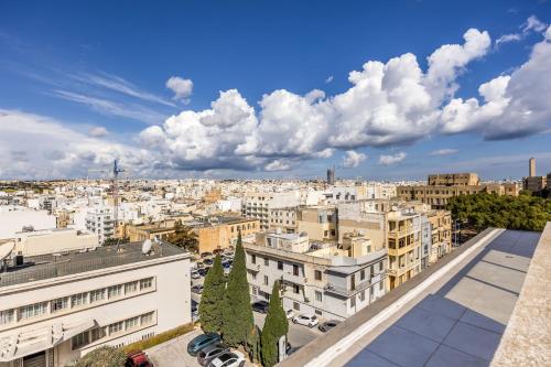 a view of a city from the roof of a building at Dolce Pieta' Penthouse in Pieta