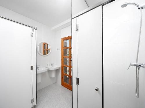 a bathroom with a shower and a sink at Sierra de Arbe in Naval