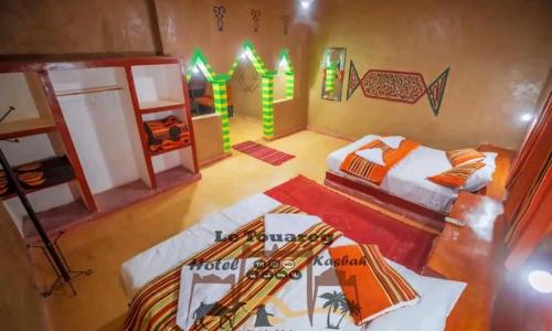 Postel nebo postele na pokoji v ubytování Hotel le Touareg