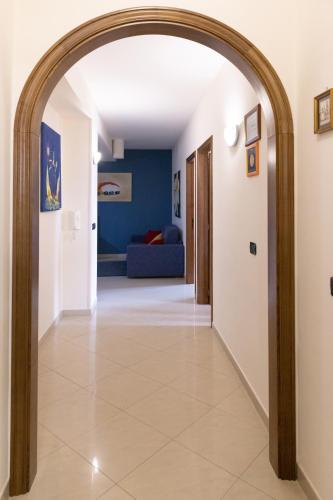 a hallway with an archway in a house at Etna Case Mangano in Linguaglossa