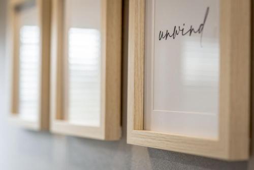 a row of wooden cabinets with the words wanted written on them at Lodge No 83 - Stewart's Resort Cameron in St. Andrews