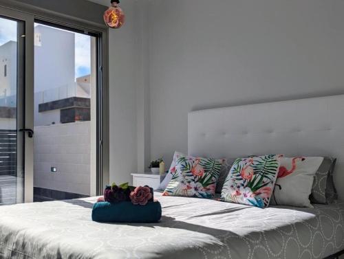 a bedroom with a large bed with a large window at Fee4Me Villa, Pool, Roofterrace & Relax in Alicante