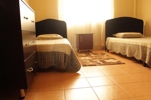 Cama o camas de una habitación en Millie Apartments Ntinda Kampala