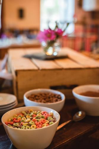 a table topped with bowls of beans and nuts at Vieja Posada Hotel Histórico in Cafayate