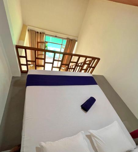 a bedroom with a bed with avisor at Maccan's Village in Arugam Bay