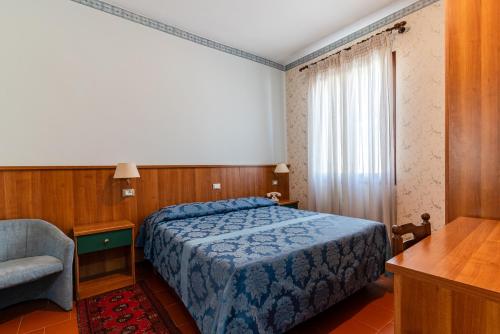 Letto o letti in una camera di Locanda Da Renzo