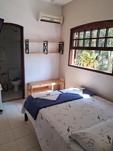 Ein Bett oder Betten in einem Zimmer der Unterkunft Pousada Astro Rei Paraty