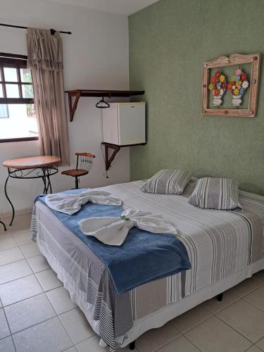 Ein Bett oder Betten in einem Zimmer der Unterkunft Pousada Astro Rei Paraty
