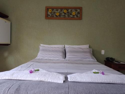 Ein Bett oder Betten in einem Zimmer der Unterkunft Pousada Astro Rei Paraty