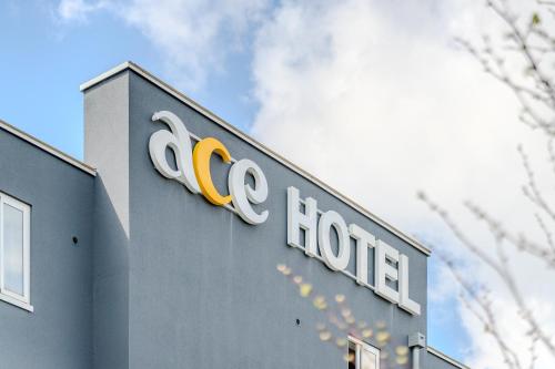 a hotel sign on the side of a building at Ace Hotel Noyelles in Noyelles-Godault