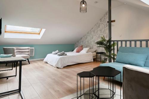 a living room with a bed and a couch at Blue Evy in Croix