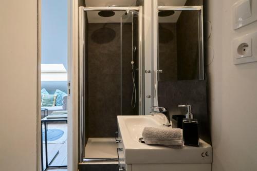 a bathroom with a sink and a shower at Blue Evy in Croix