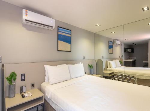 Cama ou camas em um quarto em Infinity at the Sea by Welkom