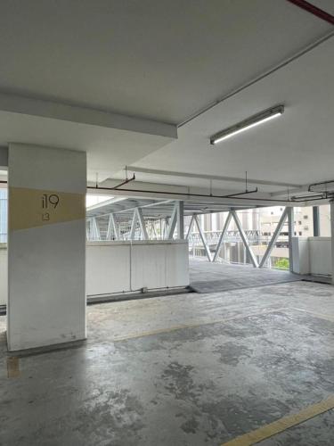 an empty room with a large building in the background at Sermenta Studio Trefoil in Setia Alam