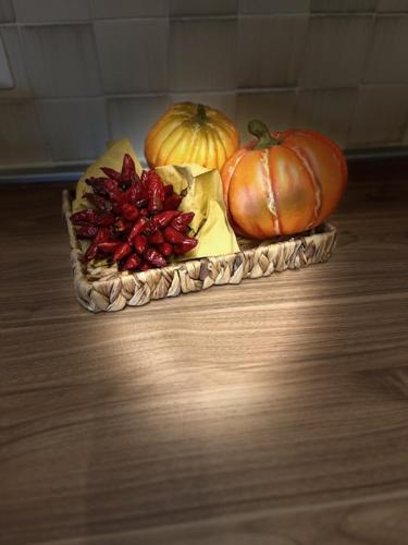 a plate of pumpkins and other vegetables on a table at My Tuscany Relais in Altopascio