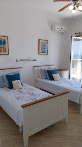 Ένα ή περισσότερα κρεβάτια σε δωμάτιο στο Villa Gecko, Arillas