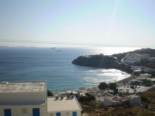 an aerial view of a city and the ocean at Maria's Kouka Pension in Agios Stefanos