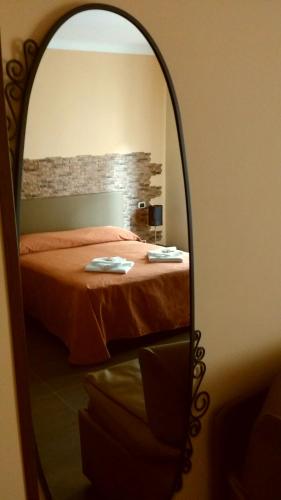 Uma cama ou camas num quarto em Jadore Monic