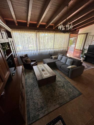 a living room with a couch and a coffee table at Giardino di Circe in Agrigento