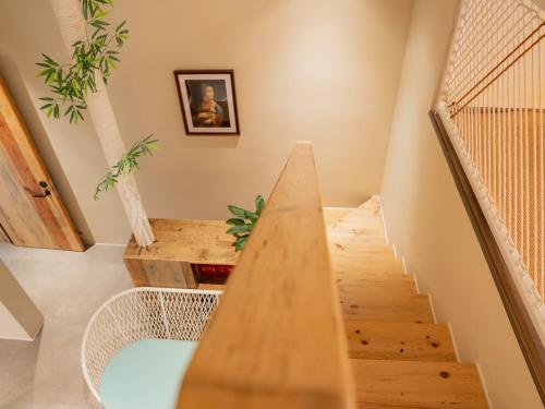a staircase in a house with a wooden floor at Patio Spring Holiday Inn -- Free round trip pick-up service --Panoramic view of Tianmen Mount in Zhangjiajie