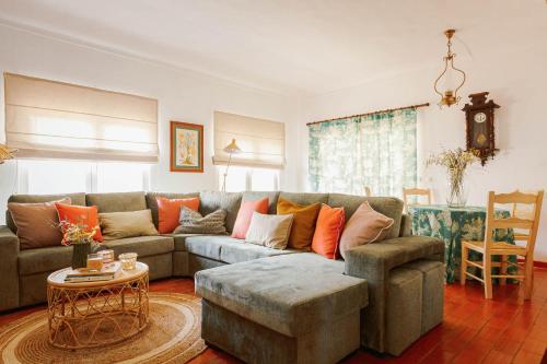 a living room with a couch and a table at Monte do Ramalho in Avis