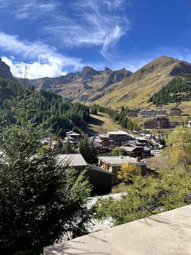a view of a town with mountains in the background at Studio La Foux Allos in Allos