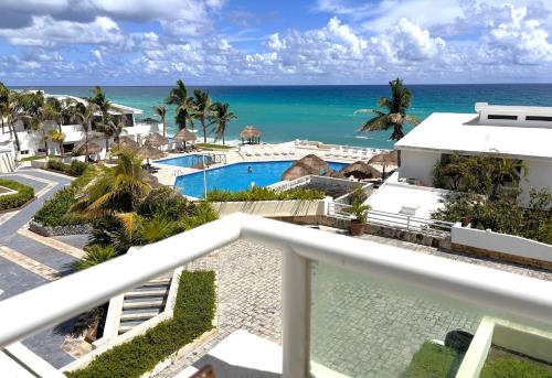 a view of the ocean from the balcony of a resort at Brisas Shores Terrace Ocean View Beachfront Apartments 1 bedroom hotel zone in Cancún