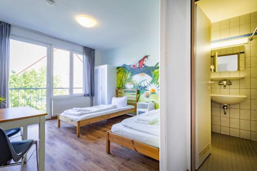 Katil atau katil-katil dalam bilik di StayInn Hostel und Gästehaus