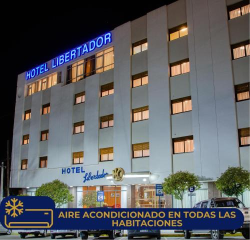 a hotel with a sign in front of it at Hotel Libertador in Trelew