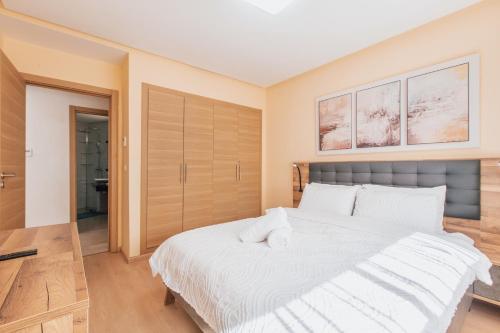 Postel nebo postele na pokoji v ubytování Migdal Gueliz Apart Hôtel