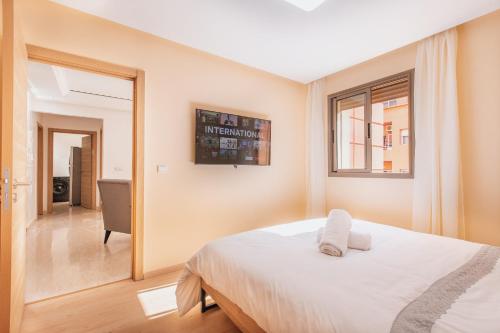 Postel nebo postele na pokoji v ubytování Migdal Gueliz Apart Hôtel