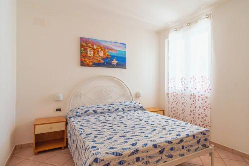 RESIDENCE OASI SUL MAREにあるベッド