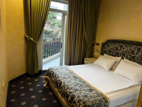 Postel nebo postele na pokoji v ubytování Addar Hotel