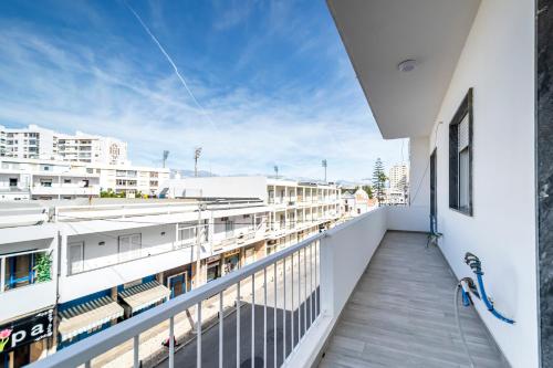 a balcony with a view of a building at GrowIN Stay Mercado in Faro