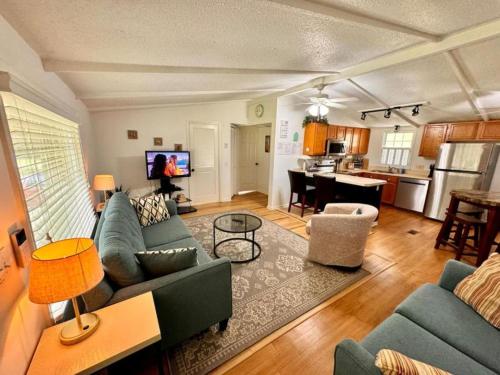 a living room with a couch and a table at 10 Minutes to the Beach. Pet Yes in Harbor Island
