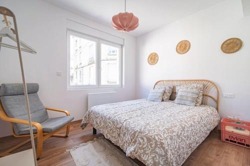 Ένα ή περισσότερα κρεβάτια σε δωμάτιο στο Balthazar Fauvette, bel appart hyper centre Epernay