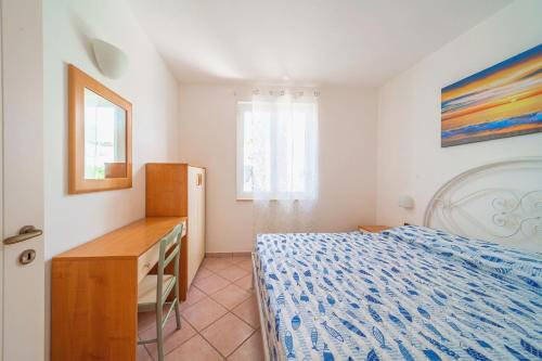 RESIDENCE OASI SUL MAREにあるベッド