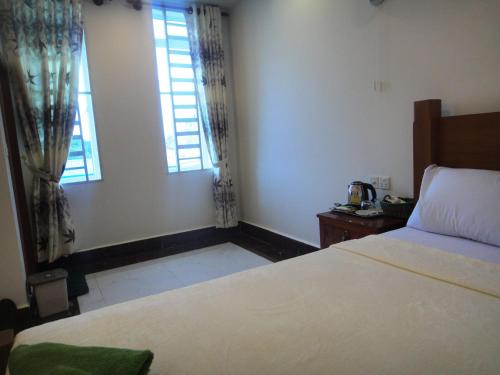 Una cama o camas en una habitación de Marany Guesthouse