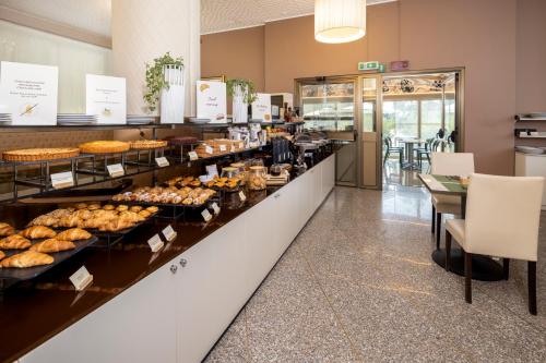 a buffet line with a lot of food on display at Best Western Air Hotel Linate in Segrate