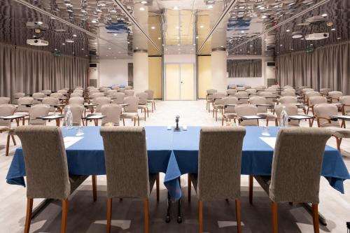 a large room with tables and chairs in it at Best Western Air Hotel Linate in Segrate