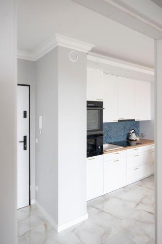 Kuchyň nebo kuchyňský kout v ubytování Apartamenty Deluxe
