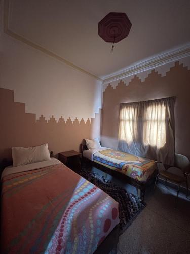 Postel nebo postele na pokoji v ubytování Taghadoute Hotel