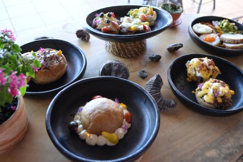 a table with plates of food on top at Hotel Aborígenes in Los Santos