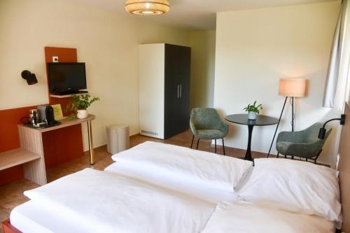 Postel nebo postele na pokoji v ubytování Hotel Sonnengarten Apartments