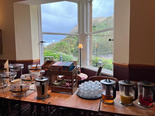 a wooden table with a view of a window at Craigside Manor in Llandudno